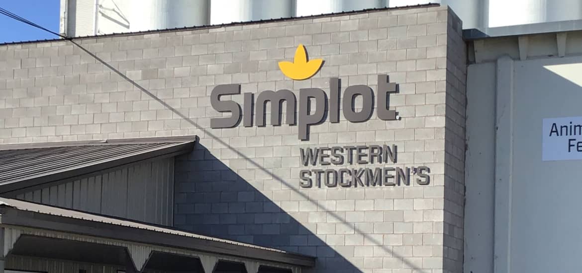 Photograph of Simplot Western Stockmen's agricultural retail store building in full sunlight with strong shadow.