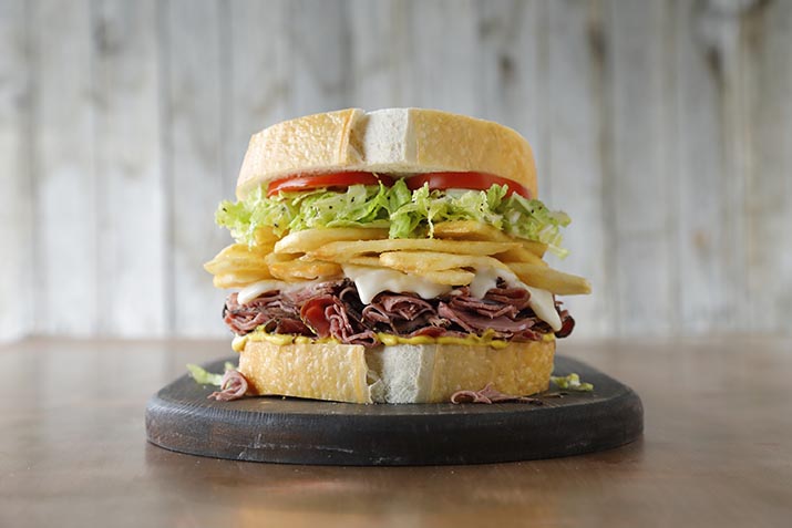 Stacked Sandwich featuring Simplot Conquest® Clear Coated Crispy Potato Strips