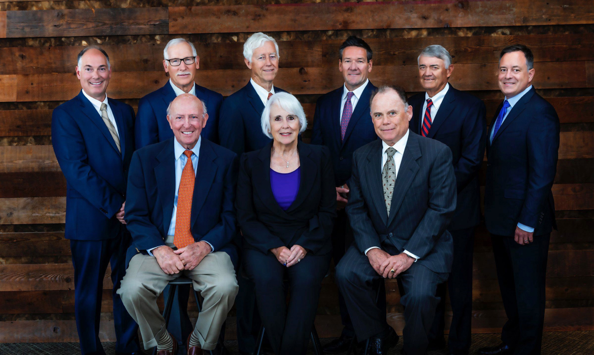Photo of the J.R. Simplot Company Board of Directors featuring all nine current members inside the global headquarters building in Boise, Idaho.
